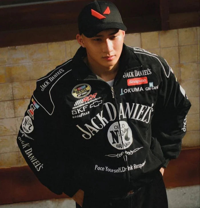 Model wearing Jack Daniels jacket on urban street, front view