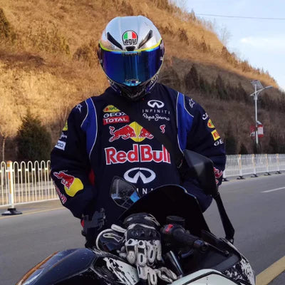 Side view of model in navy Red Bull Racing Jacket