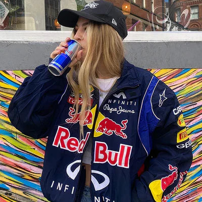 Studio shot showing back of navy Red Bull Jacket worn by model